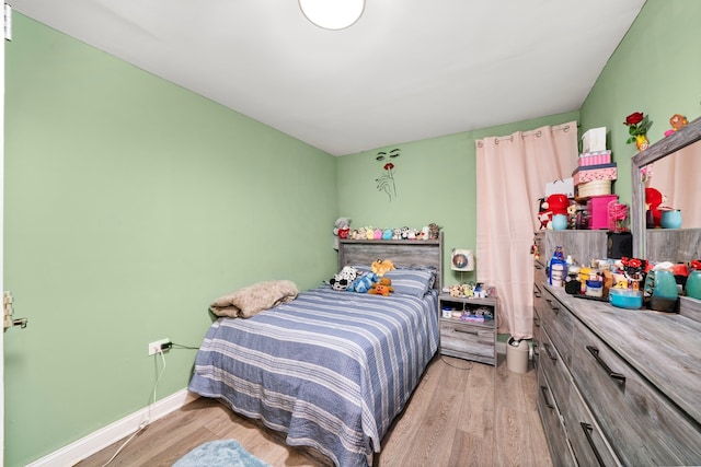 bedroom featuring wood finished floors