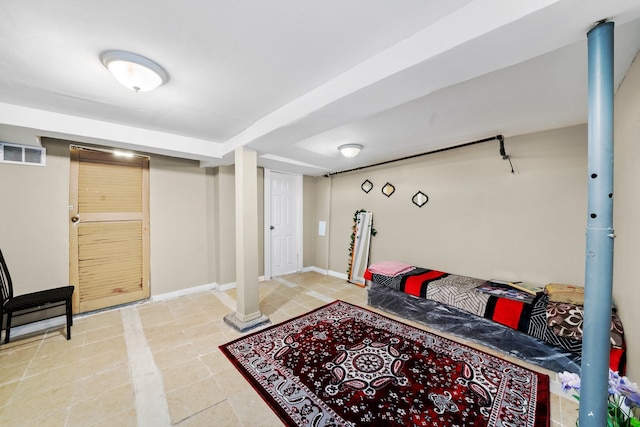 tiled bedroom featuring baseboards and visible vents