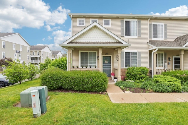 143 Foxglove Unit 143, Romeoville, IL 60446 - townhome / multi-family property with a front yard