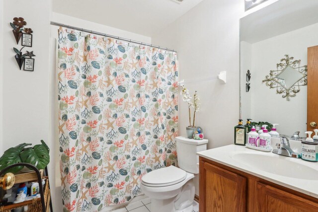 143 Foxglove Unit 143, Romeoville, IL 60446 - full bathroom featuring vanity, toilet, tile patterned flooring, and a shower with curtain