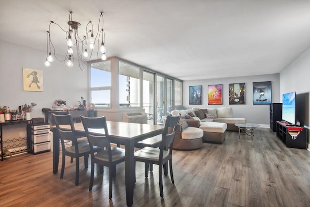 dining room with an inviting chandelier and wood finished floors
