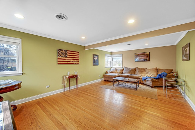 living area featuring crown molding, recessed lighting, baseboards, and light wood-type flooring