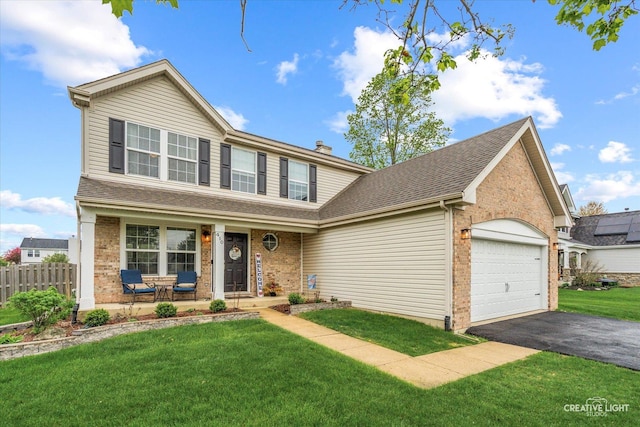 410 Blue Ridge Dr, Oswego, IL 60543 - traditional home with covered porch, brick siding, a garage, and asphalt driveway