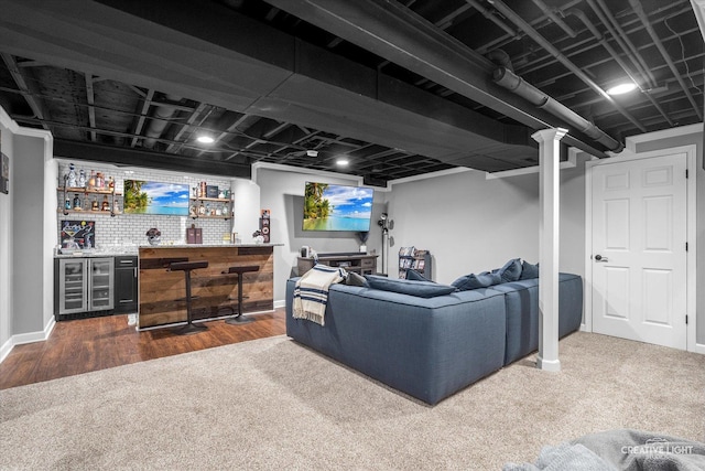 410 Blue Ridge Dr, Oswego, IL 60543 - living room with bar with sink, beverage cooler, dark colored carpet, baseboards, and dark wood finished floors