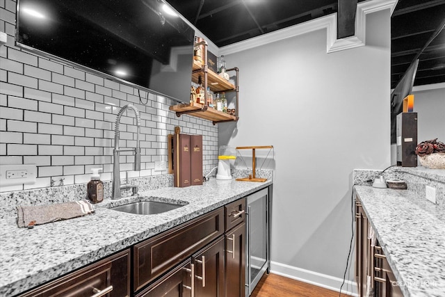 410 Blue Ridge Dr, Oswego, IL 60543 - kitchen with a sink, decorative backsplash, ornamental molding, light stone countertops, and open shelves