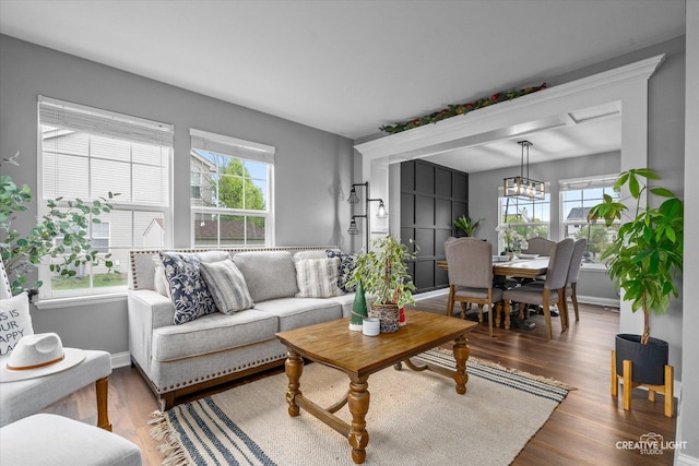 410 Blue Ridge Dr, Oswego, IL 60543 - living room featuring healthy amount of natural light, baseboards, and wood finished floors