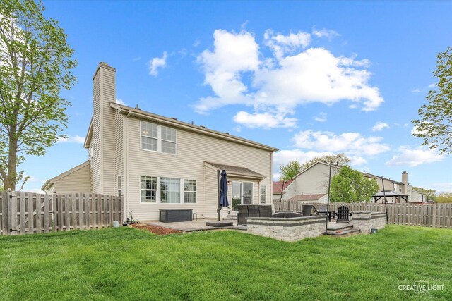 410 Blue Ridge Dr, Oswego, IL 60543 - back of house with a patio, a chimney, an outdoor hangout area, and central AC