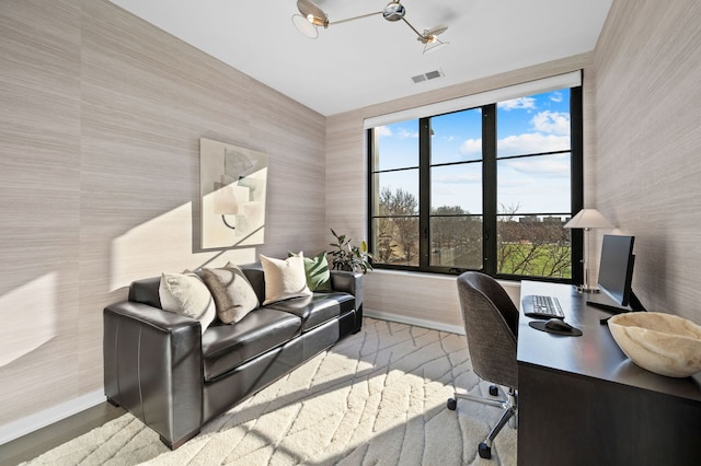 office featuring baseboards, wallpapered walls, and visible vents