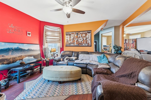 living area with ceiling fan and wood finished floors