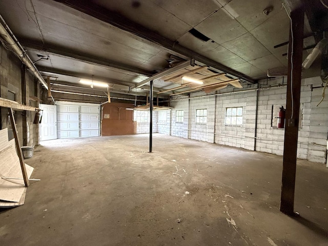 garage featuring concrete block wall