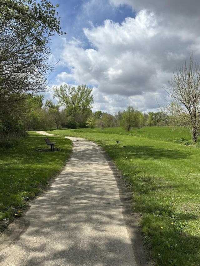 surrounding community featuring a lawn