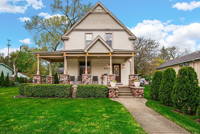 1208 Main St, Crete, IL 60417 - victorian-style house featuring a front lawn and covered porch