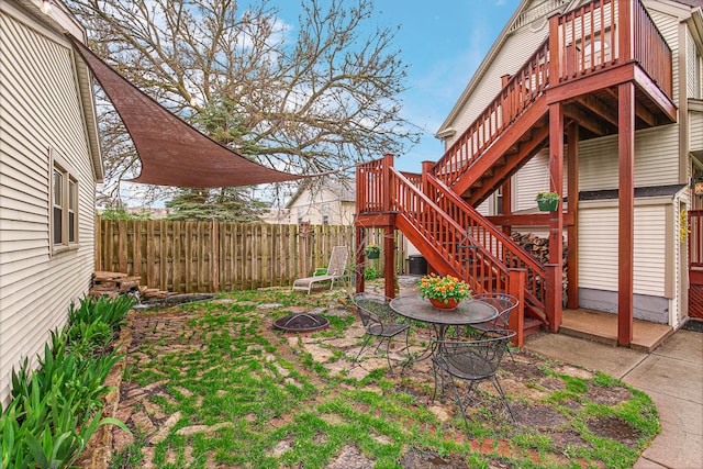 1208 Main St, Crete, IL 60417 - view of yard featuring fence, stairs, an outdoor fire pit, central AC, and a deck