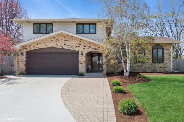 948 Weatherbee Pl, Downers Grove, IL 60516 - view of front facade featuring brick siding, driveway, and an attached garage