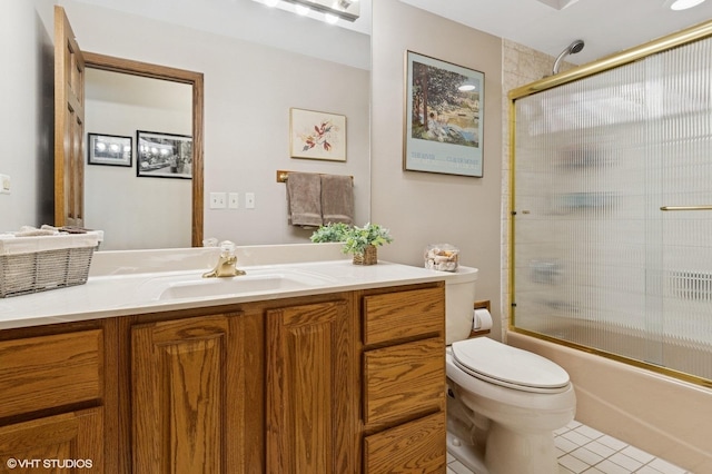 948 Weatherbee Pl, Downers Grove, IL 60516 - bathroom featuring toilet, vanity, tile patterned flooring, and shower / bath combination with glass door