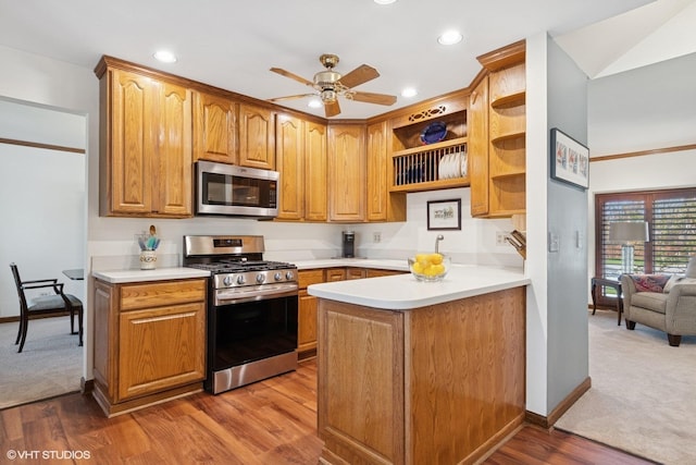 948 Weatherbee Pl, Downers Grove, IL 60516 - kitchen featuring appliances with stainless steel finishes, ceiling fan, light countertops, baseboards, and recessed lighting