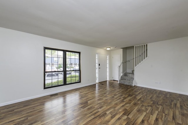 4140 Brentwood Ln, Waukegan, IL 60087 - unfurnished living room with dark wood finished floors, stairs, and baseboards