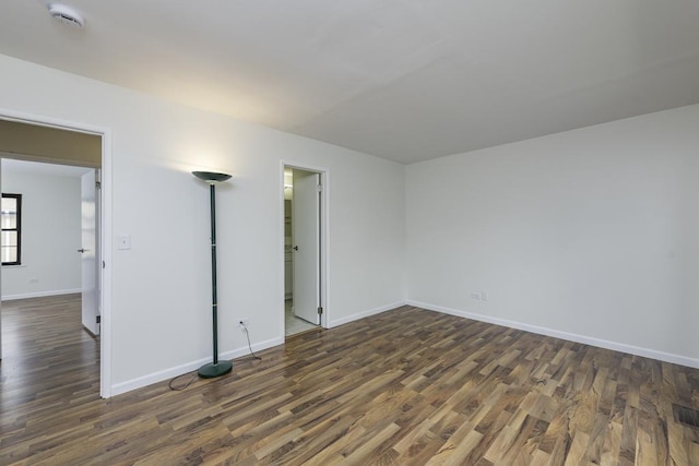 4140 Brentwood Ln, Waukegan, IL 60087 - unfurnished room featuring a smoke detector, dark wood-type flooring, and baseboards