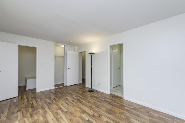 4140 Brentwood Ln, Waukegan, IL 60087 - unfurnished bedroom featuring wood finished floors, baseboards, and a closet