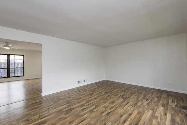 4140 Brentwood Ln, Waukegan, IL 60087 - unfurnished room featuring dark wood-type flooring, baseboards, and a ceiling fan