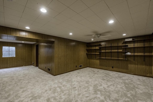 4140 Brentwood Ln, Waukegan, IL 60087 - basement featuring carpet flooring, ceiling fan, wood walls, and recessed lighting