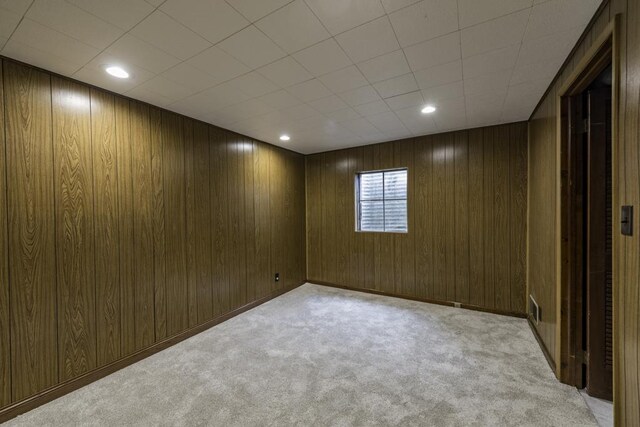 4140 Brentwood Ln, Waukegan, IL 60087 - spare room featuring light carpet, wooden walls, and recessed lighting