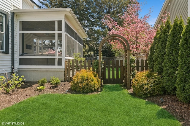 view of yard featuring a sunroom