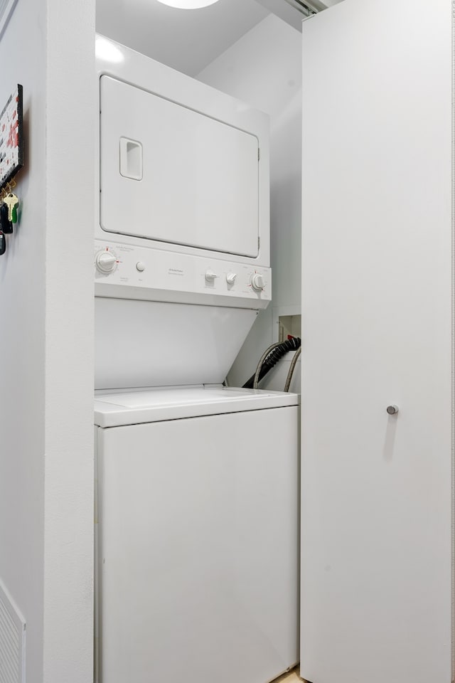washroom with laundry area and stacked washer and dryer