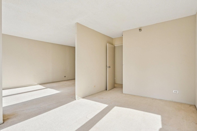 unfurnished room with carpet flooring