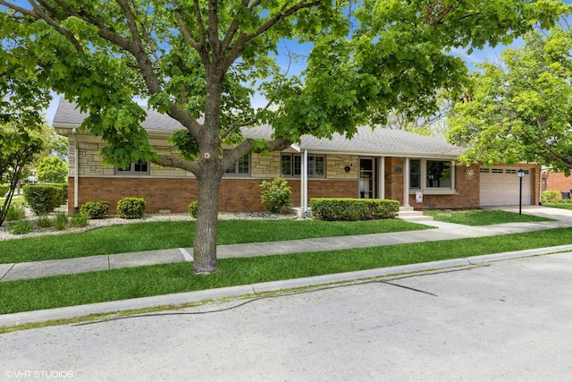 ranch-style house with a garage, brick siding, a front lawn, a shingled roof, and driveway