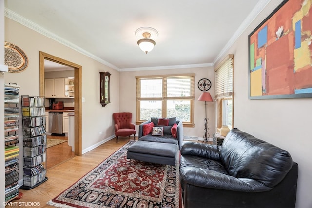 living area featuring crown molding, light wood-style floors, and baseboards