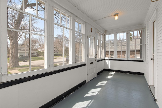 14835 Kildare Ave, Midlothian, IL 60445 - unfurnished sunroom with baseboards, wood finished floors, and a wealth of natural light