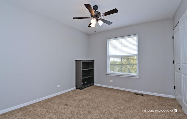 13464 W Hidden Springs Trl, Wadsworth, IL 60083 - unfurnished bedroom with carpet, baseboards, a ceiling fan, and visible vents