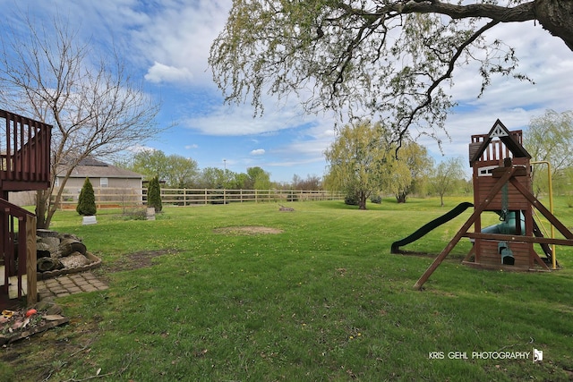 13464 W Hidden Springs Trl, Wadsworth, IL 60083 - view of yard featuring a playground and fence