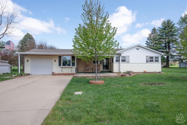 ranch-style home featuring an attached garage, concrete driveway, and a front yard