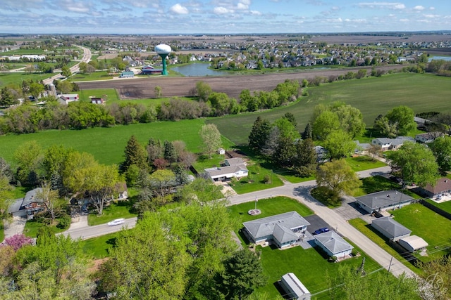 drone / aerial view featuring a water view and a residential view