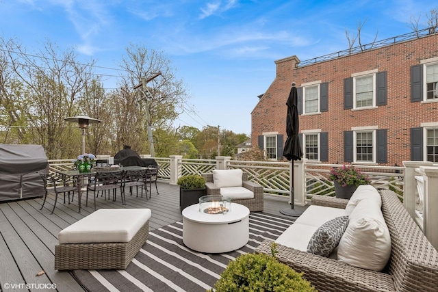 847 N Mckinley Rd, Lake Forest, IL 60045 - wooden deck with area for grilling, an outdoor living space with a fire pit, and outdoor dining space