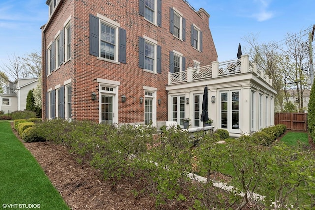 847 N Mckinley Rd, Lake Forest, IL 60045 - back of property featuring brick siding, a balcony, french doors, and fence