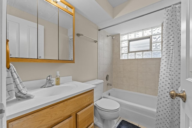 full bath featuring vanity, bathtub / shower combination, and toilet
