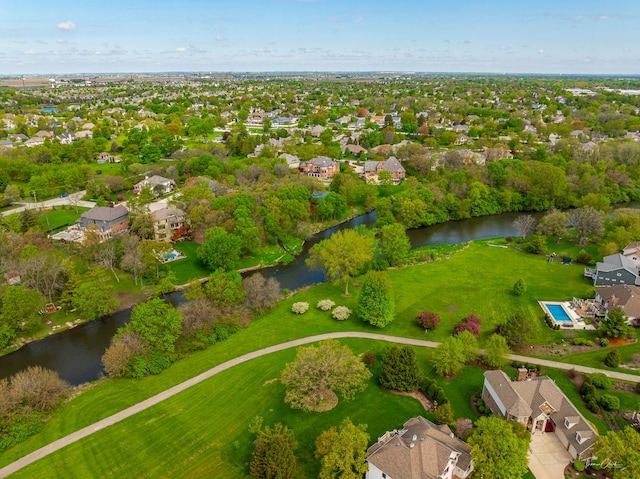 aerial view of residential area with a large body of water