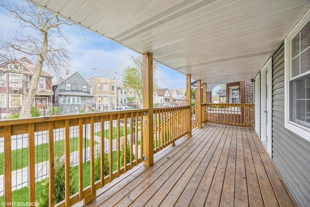 wooden deck with a residential view