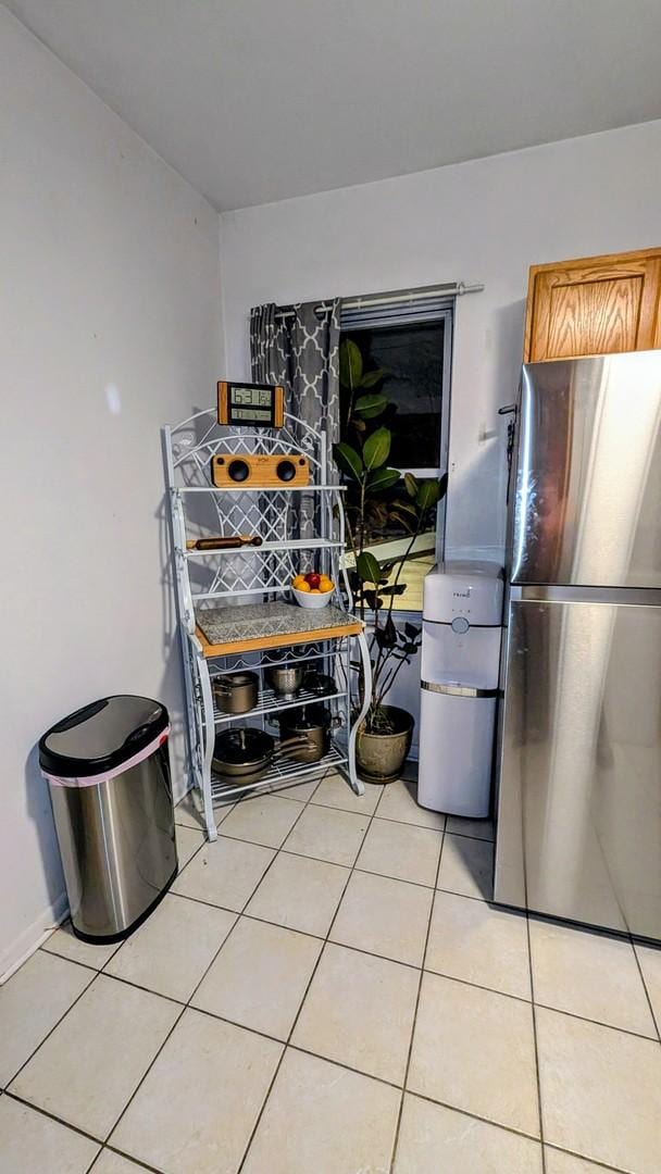dining area with light tile patterned flooring