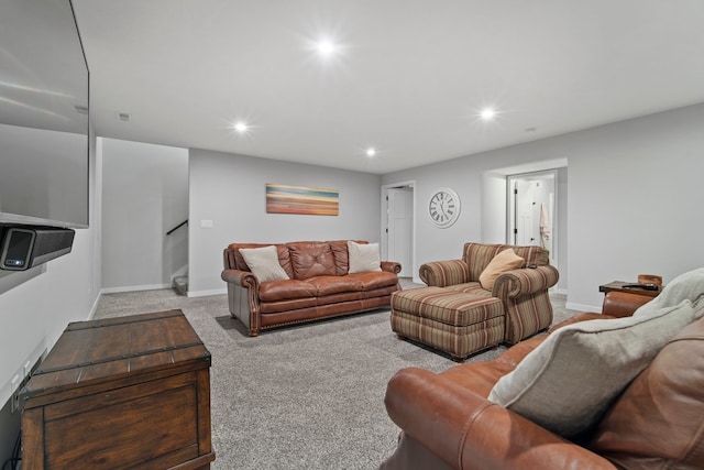 carpeted living room featuring stairs, baseboards, and recessed lighting