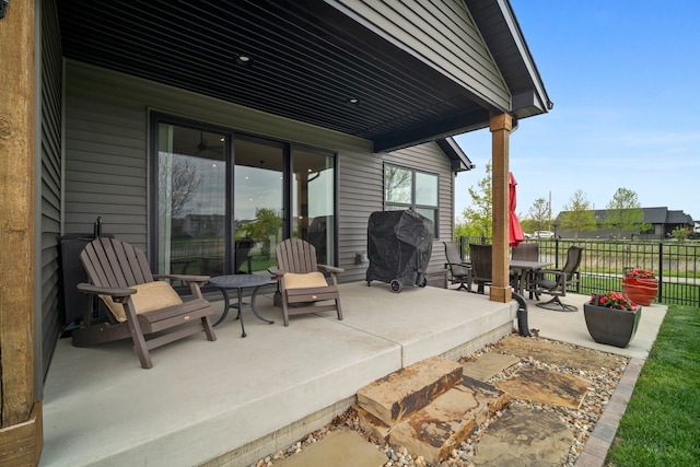 view of patio / terrace with fence, area for grilling, and outdoor dining area