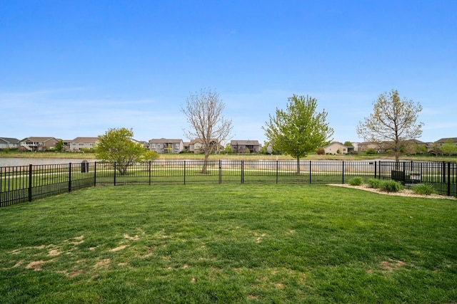 view of yard with fence and a residential view