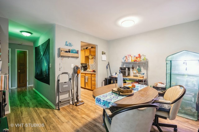 dining area with light wood-style flooring