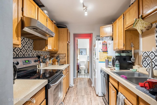 kitchen with light wood-style flooring, a sink, black dishwasher, electric range, and under cabinet range hood