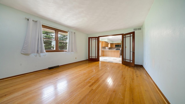 4401 Windsor Ct, Loves Park, IL 61111 - empty room with visible vents, light wood-style floors, and baseboards