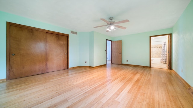 4401 Windsor Ct, Loves Park, IL 61111 - unfurnished bedroom with visible vents, a closet, baseboards, a ceiling fan, and light wood-style flooring
