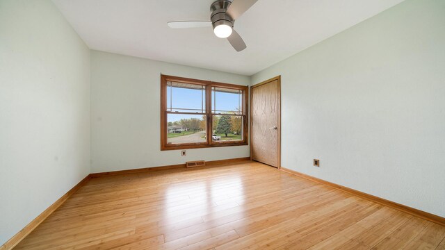 4401 Windsor Ct, Loves Park, IL 61111 - spare room featuring a ceiling fan, baseboards, visible vents, and light wood finished floors